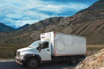 Fuel tanker track driving on the mountain road in Altai