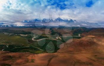 Kurai steppe and North-Chui ridge of Altai mountains, Russia. Aerial drone panoramic picture.