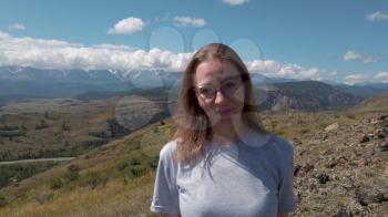 Happy woman in Altai mountains. Vacation, travel and adventure concept