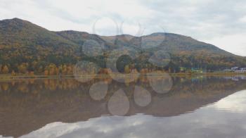 Autumn reflections of the Manjerokskoe lake, Altai Republic, Russia