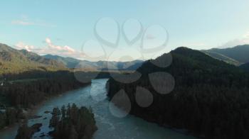 Aerial view of Katun river, in Altai mountains, in beauty summer evening, cinematic drone footage