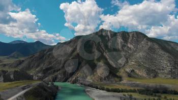The confluence of two rivers, Katun and Chuya, the famous tourist spot in the Altai mountains, Siberia, Russia, aerial 4k footage.