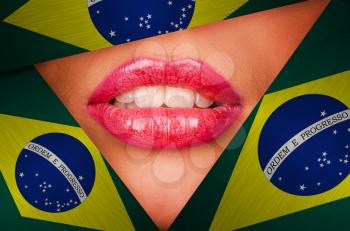 Beautiful female lips closeup behind brazil background