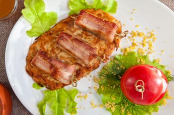 roast of veal meat with bacon with potatoes