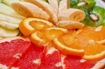Slices of various fruits closeup photo