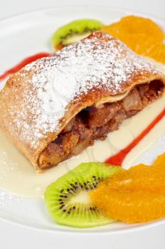 Apple strudel with fruits and sauce