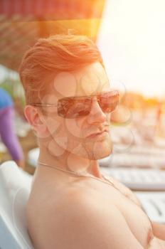 Man at the summer beach, closeup portrait