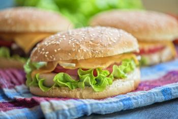 Closeup of home made burgers on wooden table