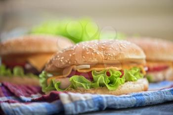 Closeup of home made burgers on wooden table