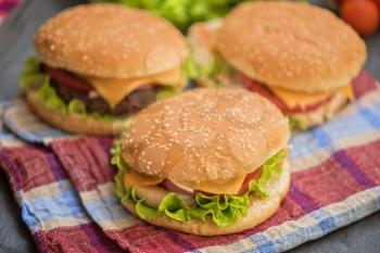 Closeup of home made burgers on wooden table