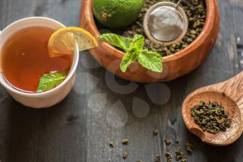 tea composition with cinnamon sticks, lemons