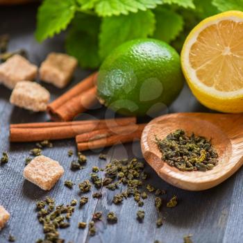 tea composition with cinnamon sticks, lemons