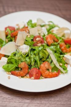 shrimp salad with cheese and arugula