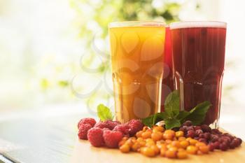 set of fruit non-alcoholic drink with cranberries raspberries and sea buckthorn