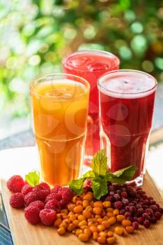 set of fruit non-alcoholic drink with cranberries raspberries and sea buckthorn