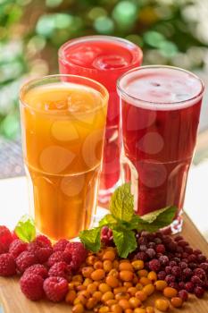 set of fruit non-alcoholic drink with cranberries raspberries and sea buckthorn