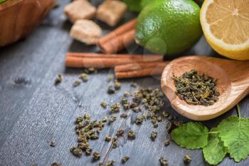 tea composition with cinnamon sticks, lemons