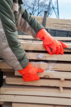 Carpenter working at sawmill, closeup photo