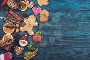 Gingerbreads for new years and christmas on wooden background, xmas theme