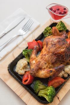 Roasted chicken with vegetables. Thanksgiving or christmas theme.