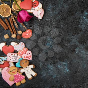 Gingerbreads for Valentines Day on dark concrete background