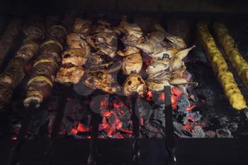 Grilling marinated shashlik on a grill