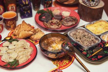 Table with traditional russian food decorated in russian style