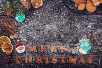 Gingerbreads for christmas on wooden background