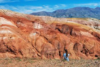 Woman in valley of Mars landscapes in the Altai Mountains, Kyzyl Chin, Siberia, Russia