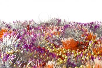 Christmas and New Year decoration - colorful bright tinsel over white background