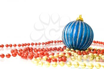 Christmas decoration - colorful beads and striped blue ball over white
