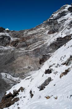 Mountains and snow viewed from Renjo pass in Himalayas. Hiking in Nepal