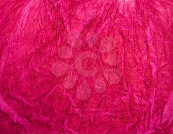 Magenta crumpled handmade paper texture. Natural background