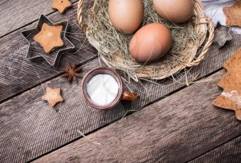 Eggs for Christmas pastry and homemade cookies   in rustic style. Space for text