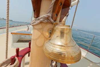 Brass bell on the private sail yacht.