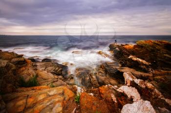 Beautiful sunset on a rocky ocean shore