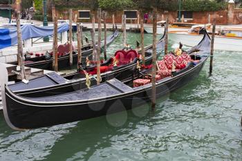 Venice, Italy - April 1, 2013: Street views of canals and ancient architecture in Venice, Italy. Venice is a city in northeastern Italy sited on a group of 118 small islands separated by canals and li