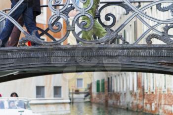 Venice, Italy - April 1, 2013: Street views of canals and ancient architecture in Venice, Italy. Venice is a city in northeastern Italy sited on a group of 118 small islands separated by canals and li