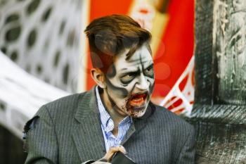 Jackson, USA-September 24, 2016: Street performer in Halloween costume and makeup is entertaining crowds.