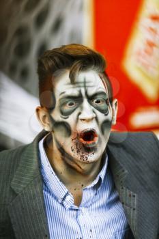 Jackson, USA-September 24, 2016: Street performer in Halloween costume and makeup is entertaining crowds.