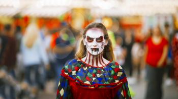 Jackson, USA-September 24, 2016: Street performer in Halloween costume and makeup is entertaining crowds.