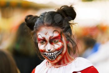 Jackson, USA-September 24, 2016: Street performer in Halloween costume and makeup is entertaining crowds.