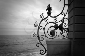 Ironwork fence by the ocean.