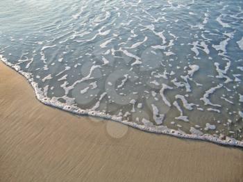 sea wave on sand background