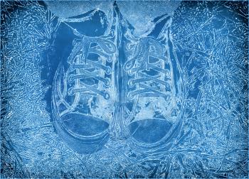Abstract graphic image of feet in sneakers on a blue vintage background