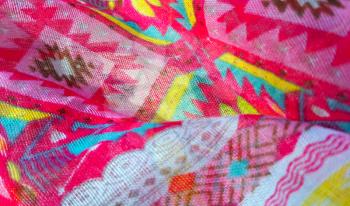 Closeup of fabric texture with bright colorful pattern 