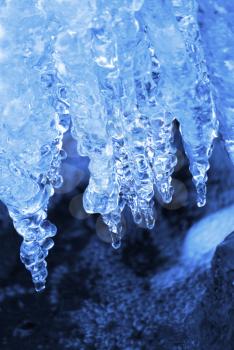 Winter natural background with icicles closeup