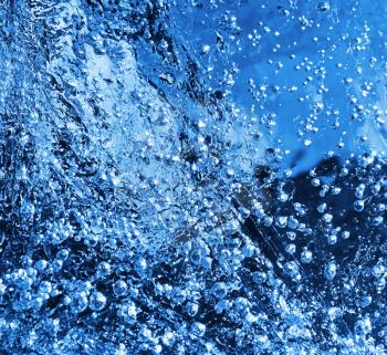 Macro of blue ice texture with frozen bubbles