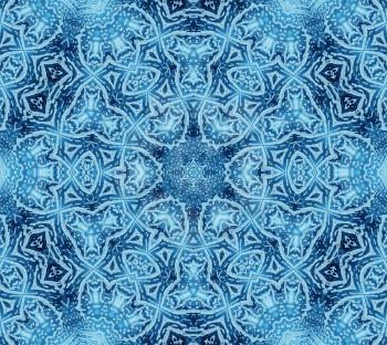 Bright blue abstract concentric pattern with soap foam on glass