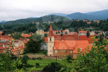 Beautiful view at the old bohemian little town Czech Krumlov (Cesky Krumlov) and nearby hills and mountains, Czech Republic